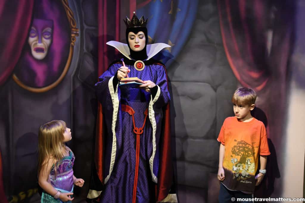 Greeting the Evil Queen at Storybook Dining at Artist Point with Snow White.