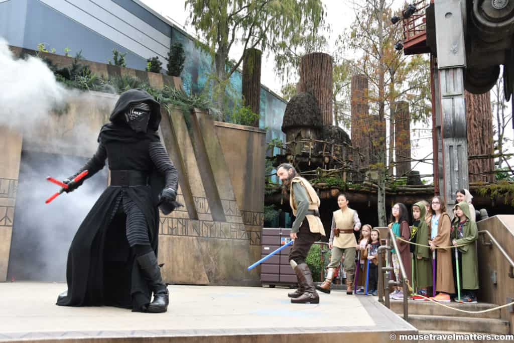 Learn all about Jedi Training at Walt Disney World and these easy tips and tricks that you can use to make sure your kids get to battle the dark side. #starwars #disneykids