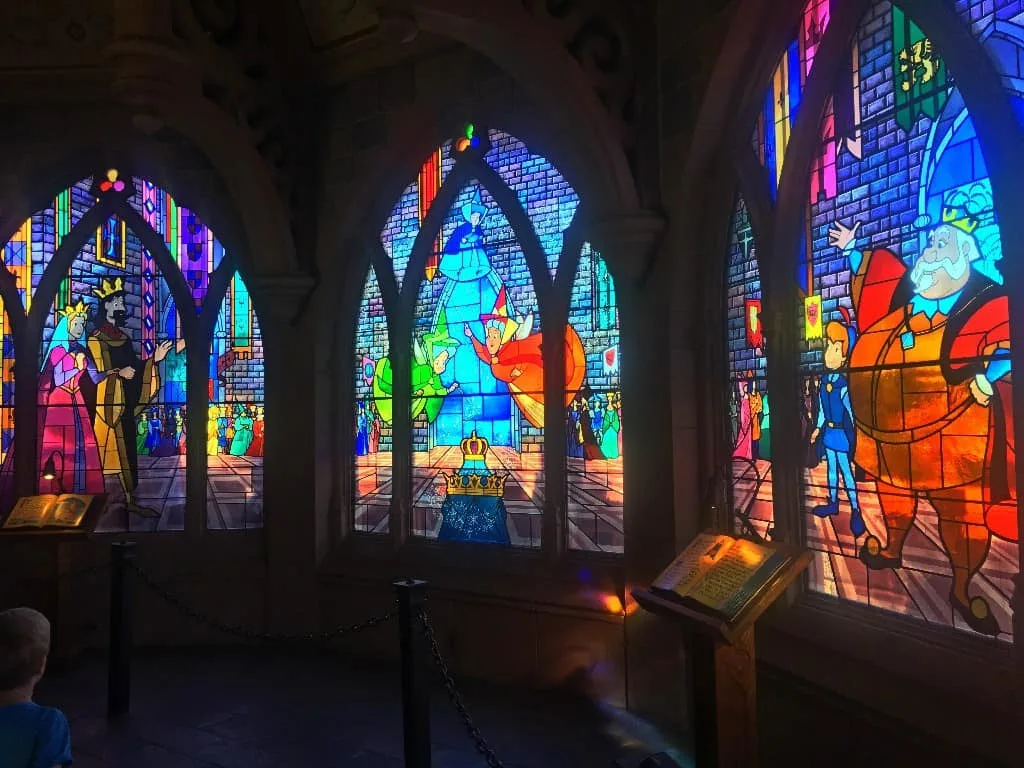 Inside Sleeping Beauty Castle you will find a sleeping dragon the story of Aurora told through stained glass tapestries along with a dragon's lair!